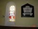 Inside Holy Trinity church, Ballysadare, Sligo, showing stained-glass window & memorial to Robert Culbertson Esqr., J.P.