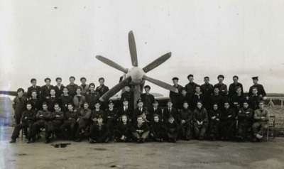  Lt Cdr D B Law seated centre 